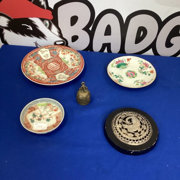 Antique Japanese Imari plate with floral design and vibrant colours.