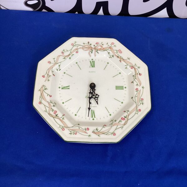Vintage Eternal Beau porcelain wall clock with floral details.