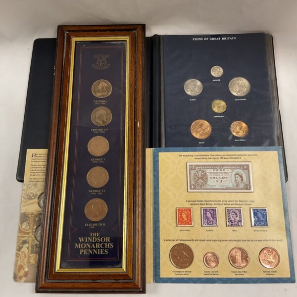 Framed collection of Windsor monarchs pennies and British commemorative coins.