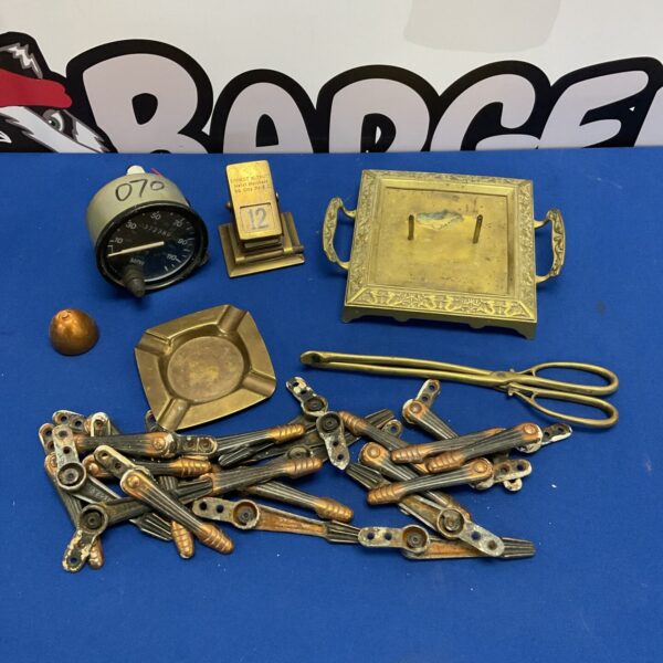 Vintage metalware lot featuring a day date calendar and car speedometer.