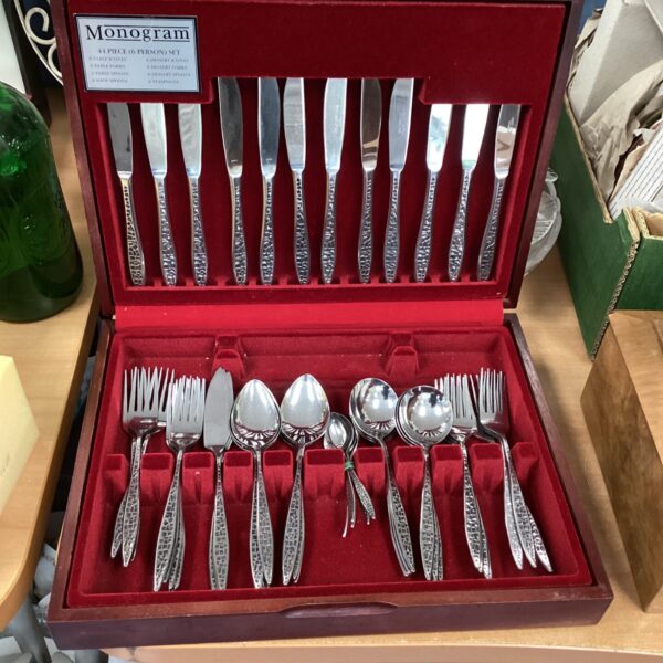 Vintage monogram cutlery set in a red velvet case.