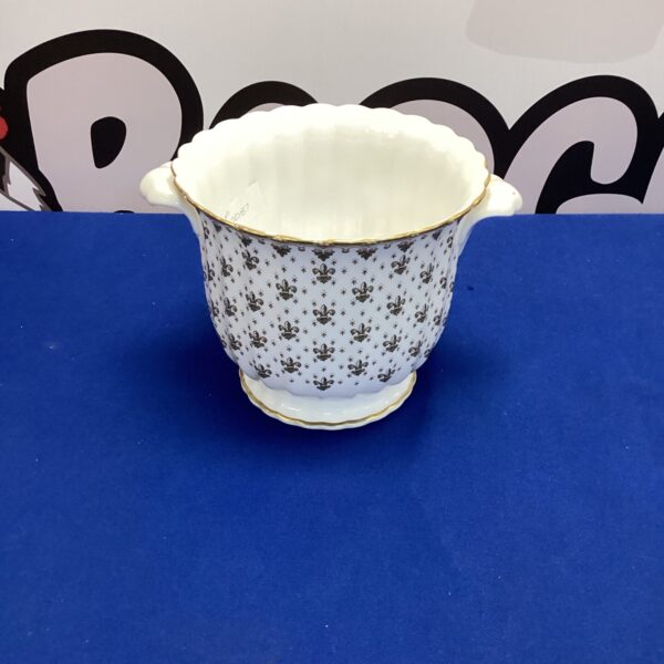 Vintage Spode flower pot with a colourful floral pattern.