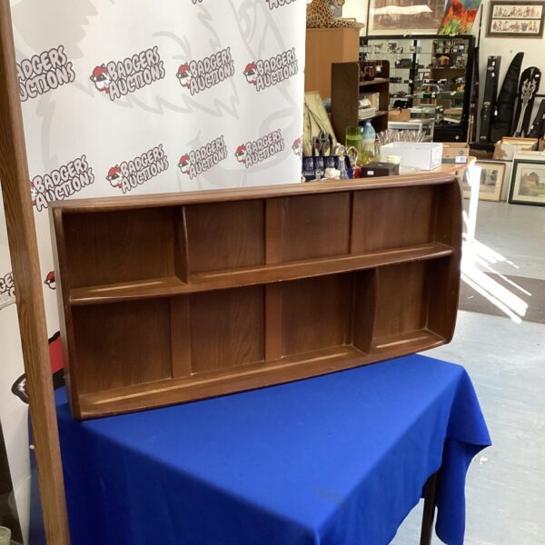 Vintage Ercol plate rack, a classic mid-century modern wall shelf.