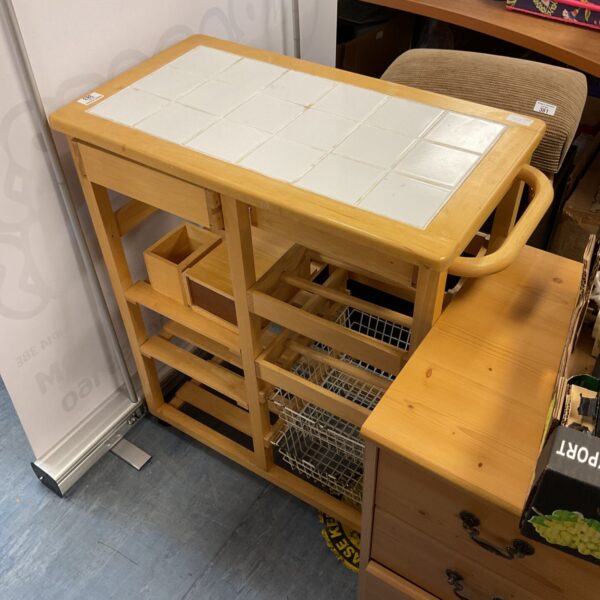 Beach style kitchen trolley unit with tile top.