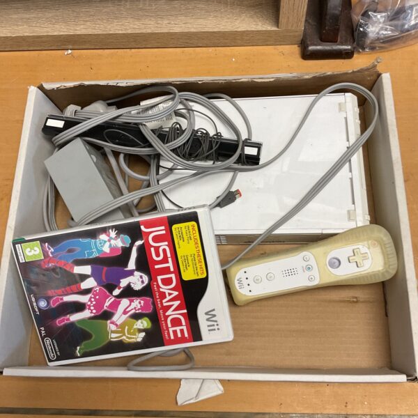Nintendo Wii console bundle with game and accessories.
