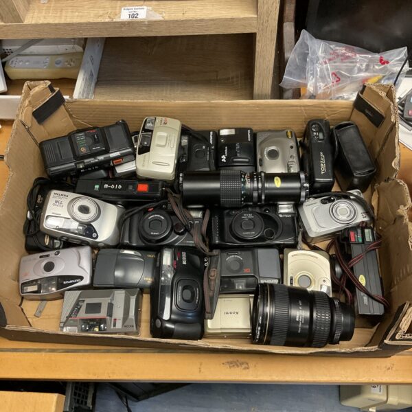 Vintage 35mm camera lot with various lenses and bodies.