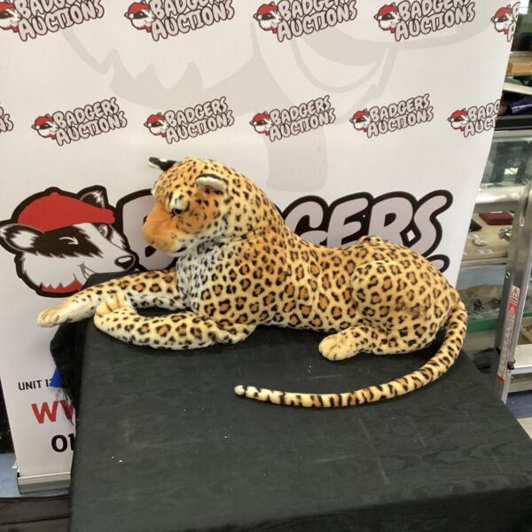 Large soft toy leopard plush animal for display or cuddling.
