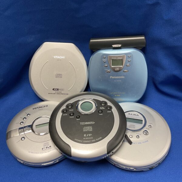 Vintage lot of personal CD players from Hitachi and Panasonic.