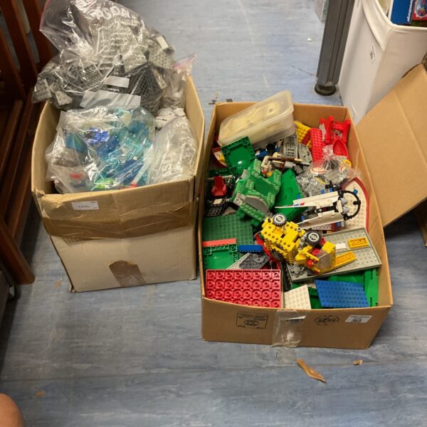 Mixed Lego lots in two cardboard boxes, colourful building blocks.