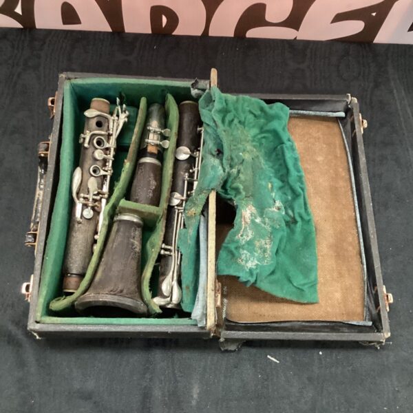 Antique clarinet with original case, vintage woodwind instrument.