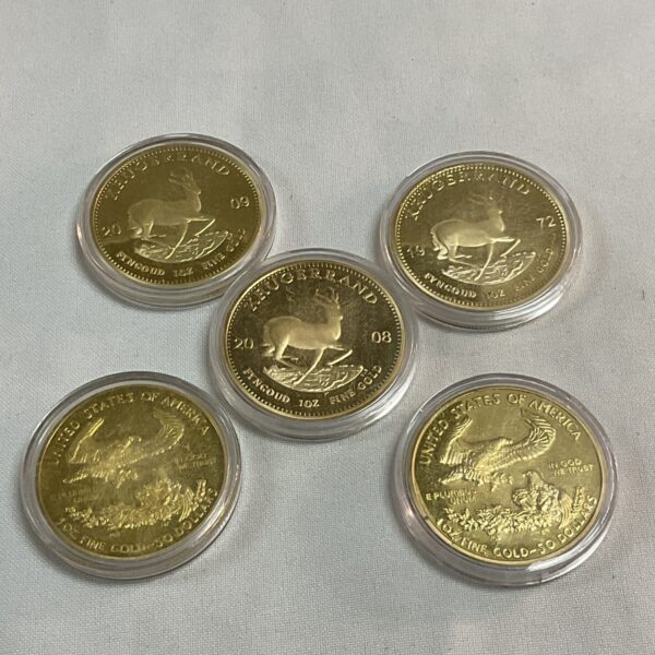 Replica Krugerand and US gold coins, collectible numismatic items.