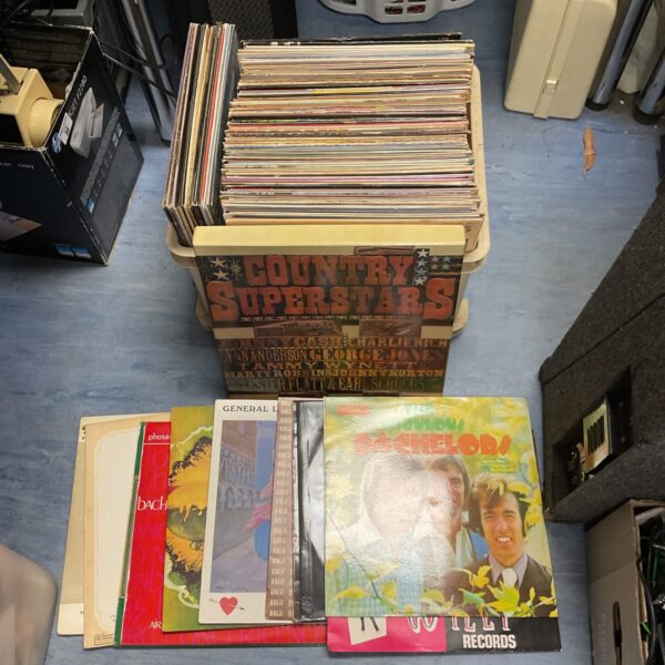 Vintage vinyl record collection featuring country music LPs.