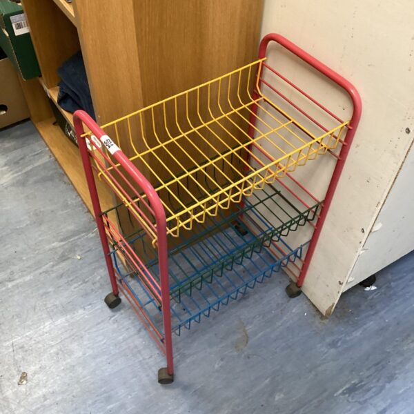 Colourful vintage wire racking trolley with three tiers.