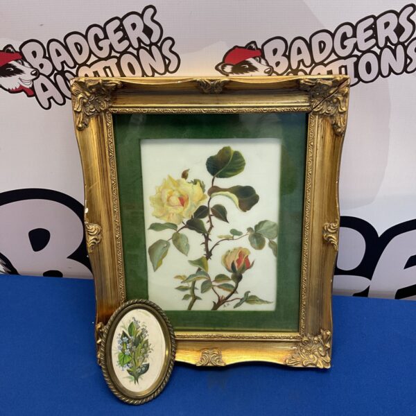 Antique opaque glass painting of roses in a gilt frame.