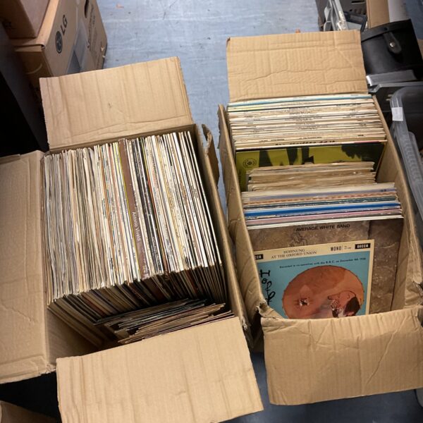 Assorted vinyl records lot including 12” and 7” records.