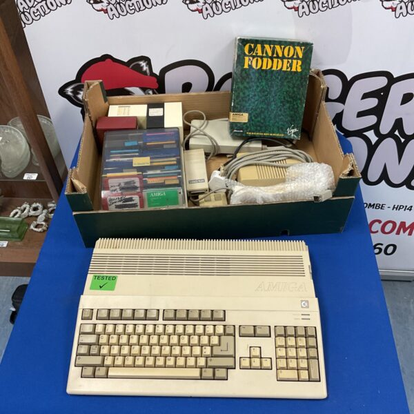 Vintage Commodore Amiga A500 computer with games and software.