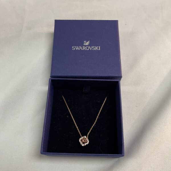 Sparkling Swarovski crystal shimmer pendant necklace in rose gold.