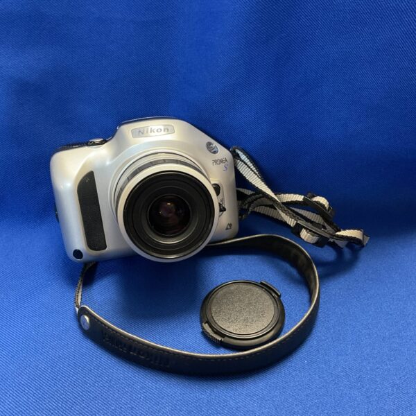 Vintage Nikon Proena S bridge camera with strap.