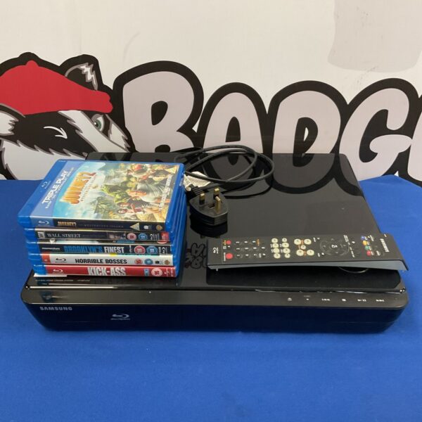 Black Samsung HT-BD1252 Blu-Ray player with remote control.