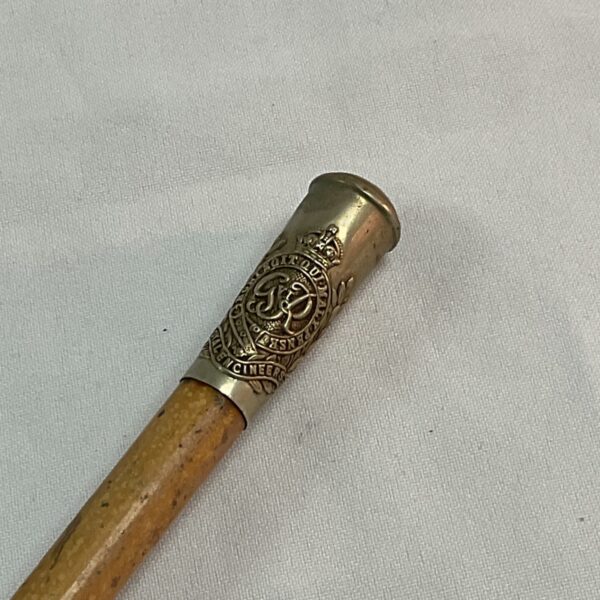 Antique Royal Engineers swagger stick with detailed brass emblem.