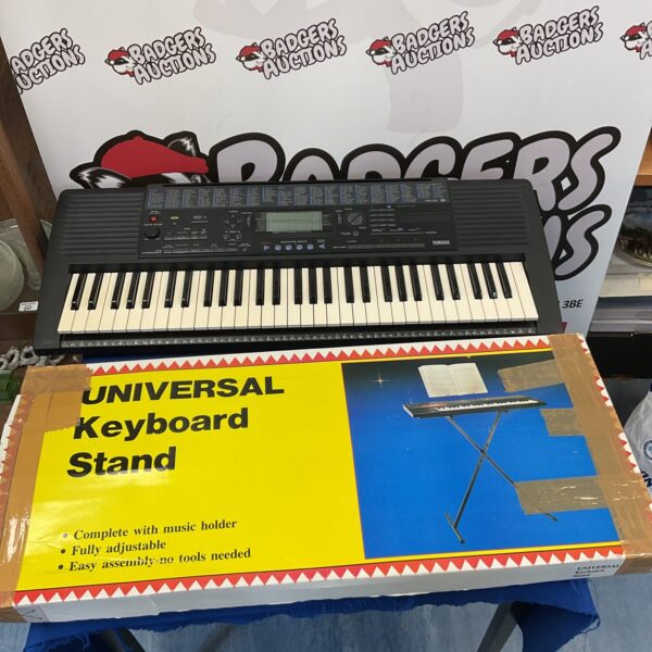 Yamaha PSR-320 keyboard with stand, electronic musical instrument.