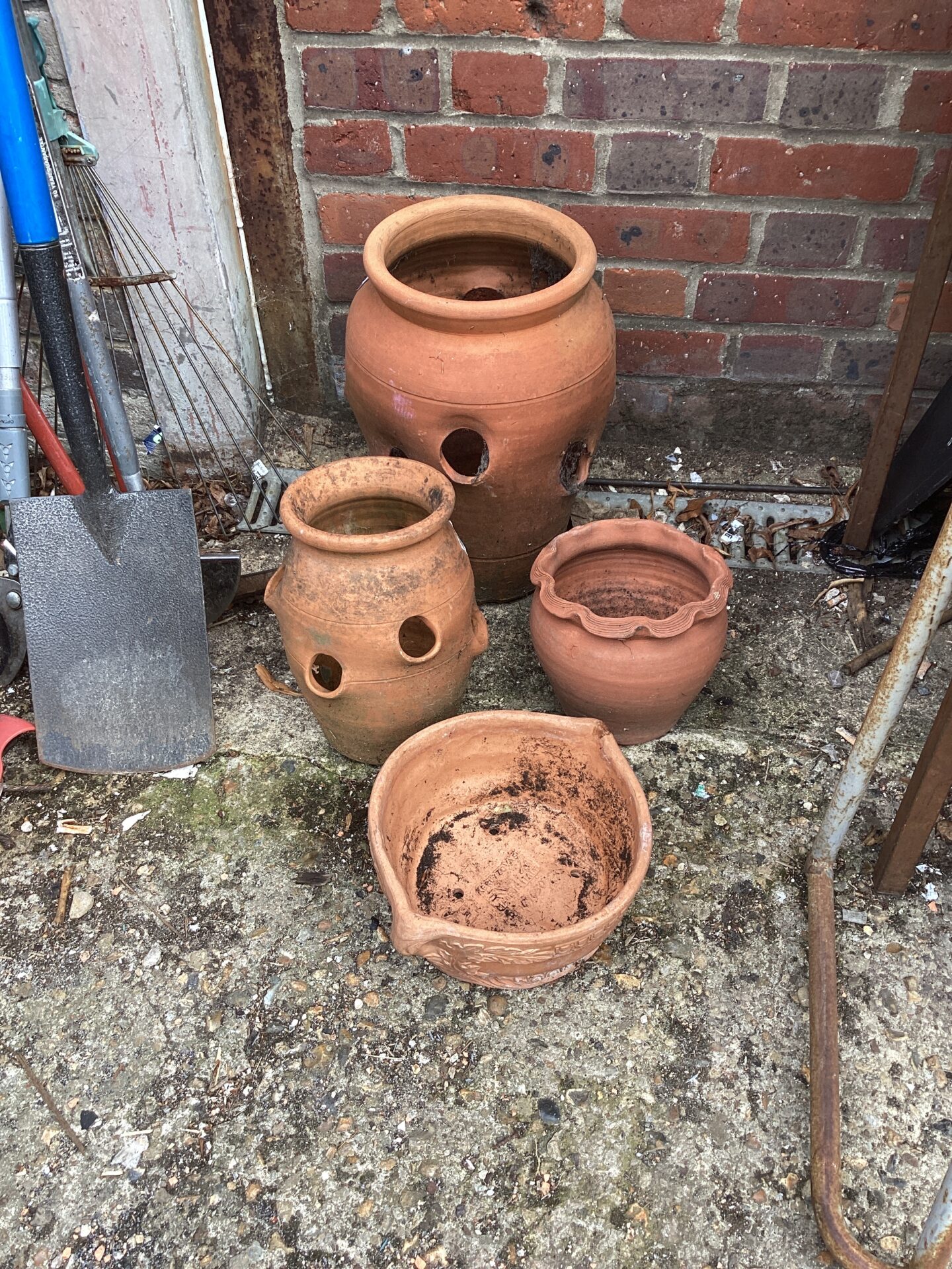 1069 Four terracotta garden pots