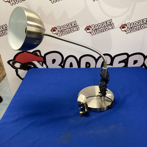 Vintage metal table lamp with adjustable head and weighted base.