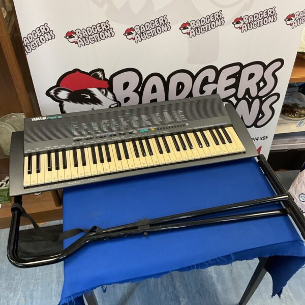 Used Yamaha PSR-19 keyboard with stand for sale.