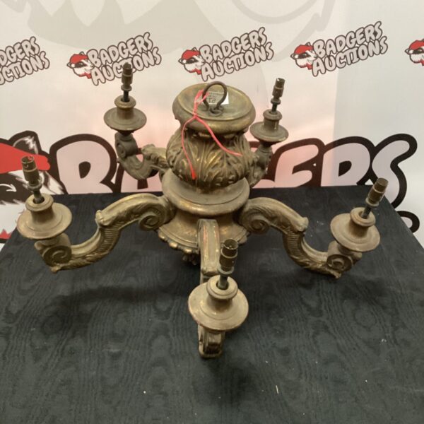 Vintage wooden ceiling light with multiple arms.