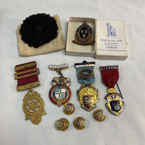 Antique Masonic steward jewels and badges collection, vintage regalia.