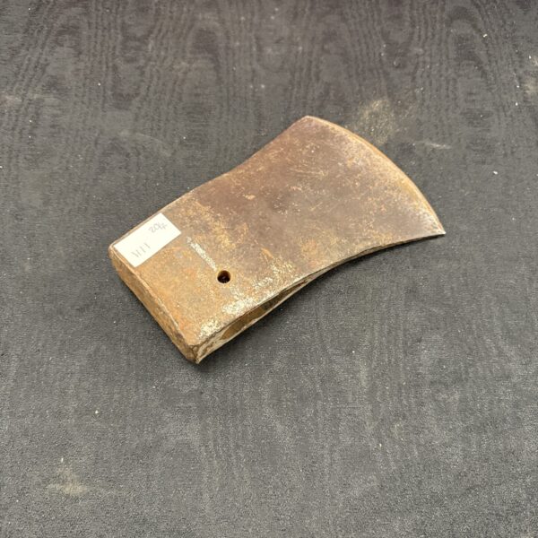 Vintage Elwell axe head, a classic forestry tool in used condition.