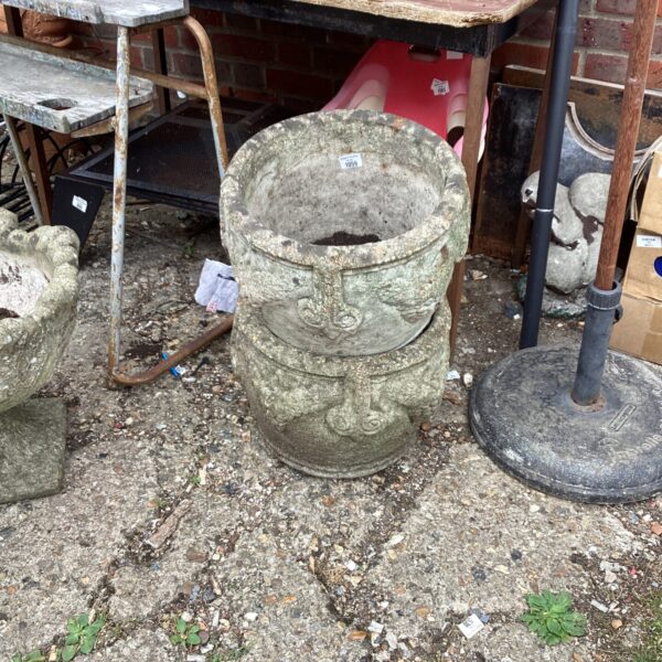 Weathered stone garden planter for outdoor plants and garden decor.