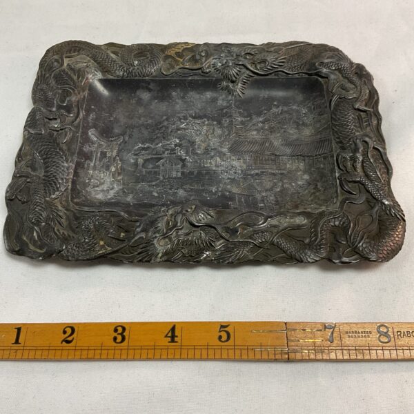 Antique Japanese pewter tray with dragon and landscape design.