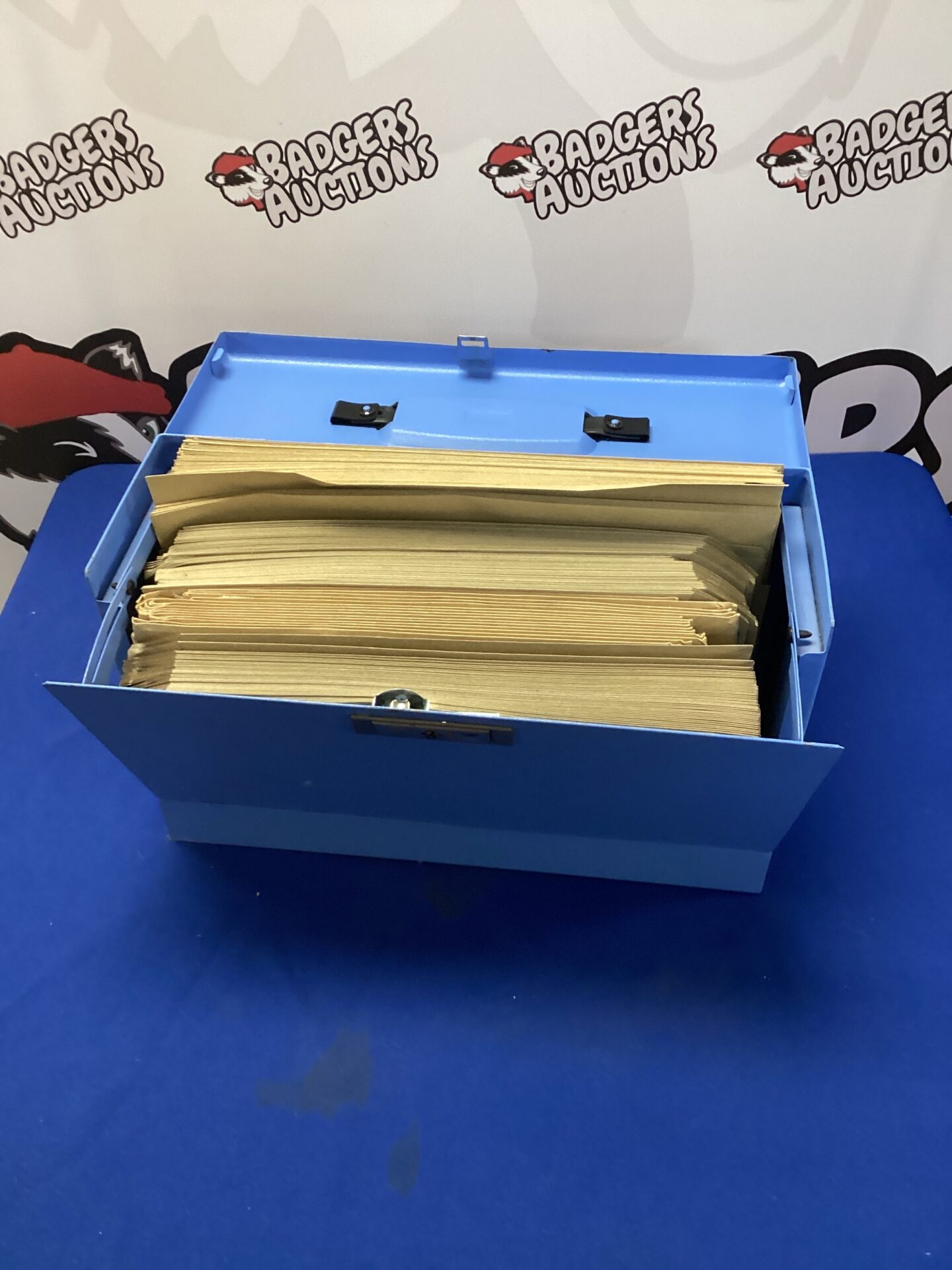 558 Metal filing box with brown envelopes inside