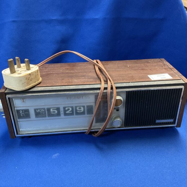Vintage Taiyo Digimat 55 clock radio with wood-effect case.