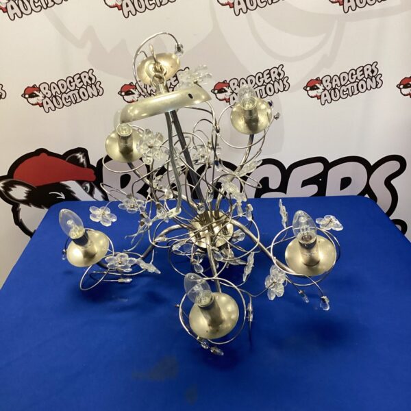 Vintage floral chandelier with frosted glass shades.