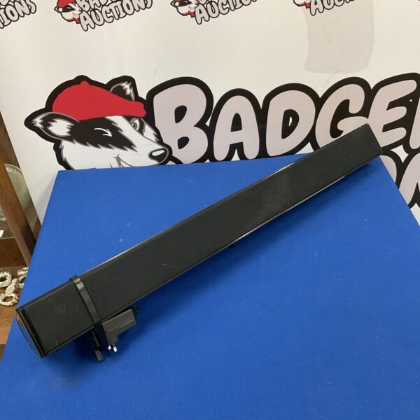 Front view of the Celcus Bluetooth soundbar with power supply.