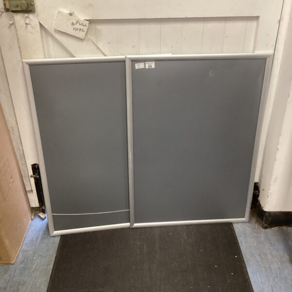 Two silver poster frames for displaying artwork and prints.