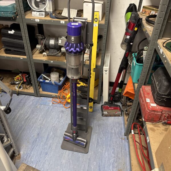 Dyson V10 Animal cordless vacuum with charging stand.