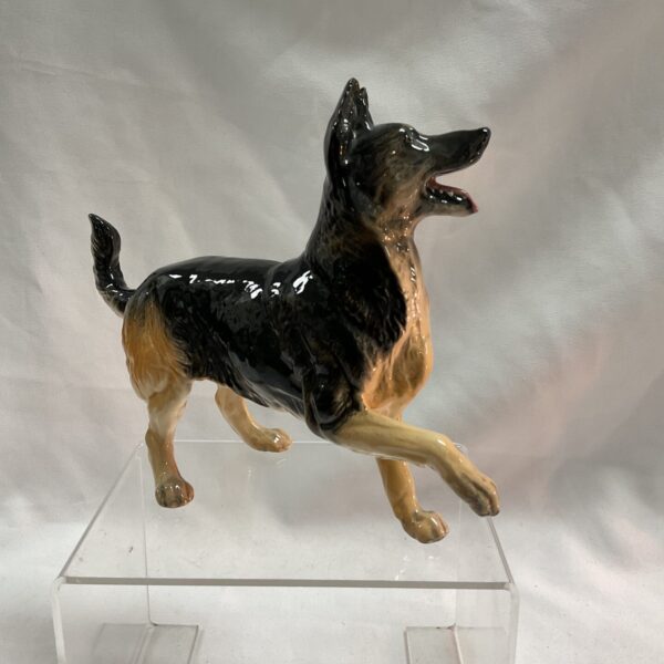 Vintage Beswick Alsatian dog figurine in glossy black and tan.