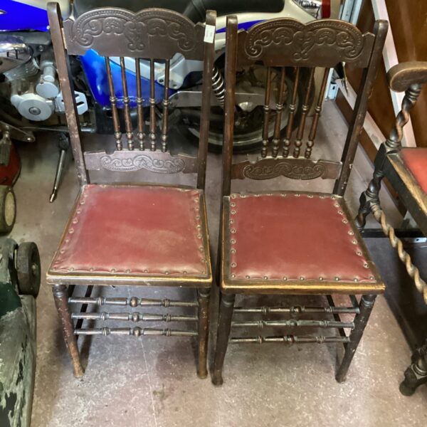 Pair of antique carved oak chairs by Lafkin.