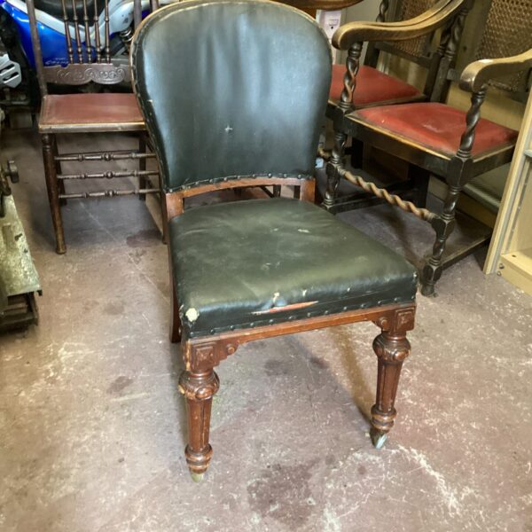 Antique Victorian oak occasional chair with castors.