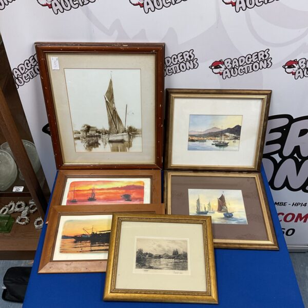 Framed lot of nautical prints and signed watercolours for coastal decor.