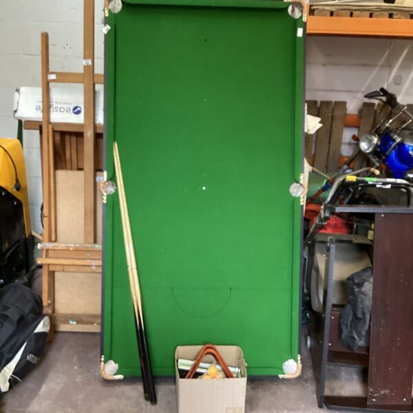 Green baize half size snooker table with cues.