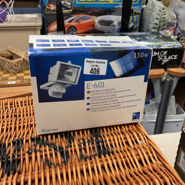 Vintage E-601 security floodlight with motion sensor for outdoor use.