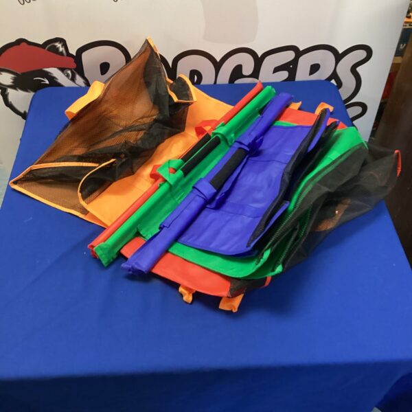 Assorted colourful plastic shopping bags in a bundle.