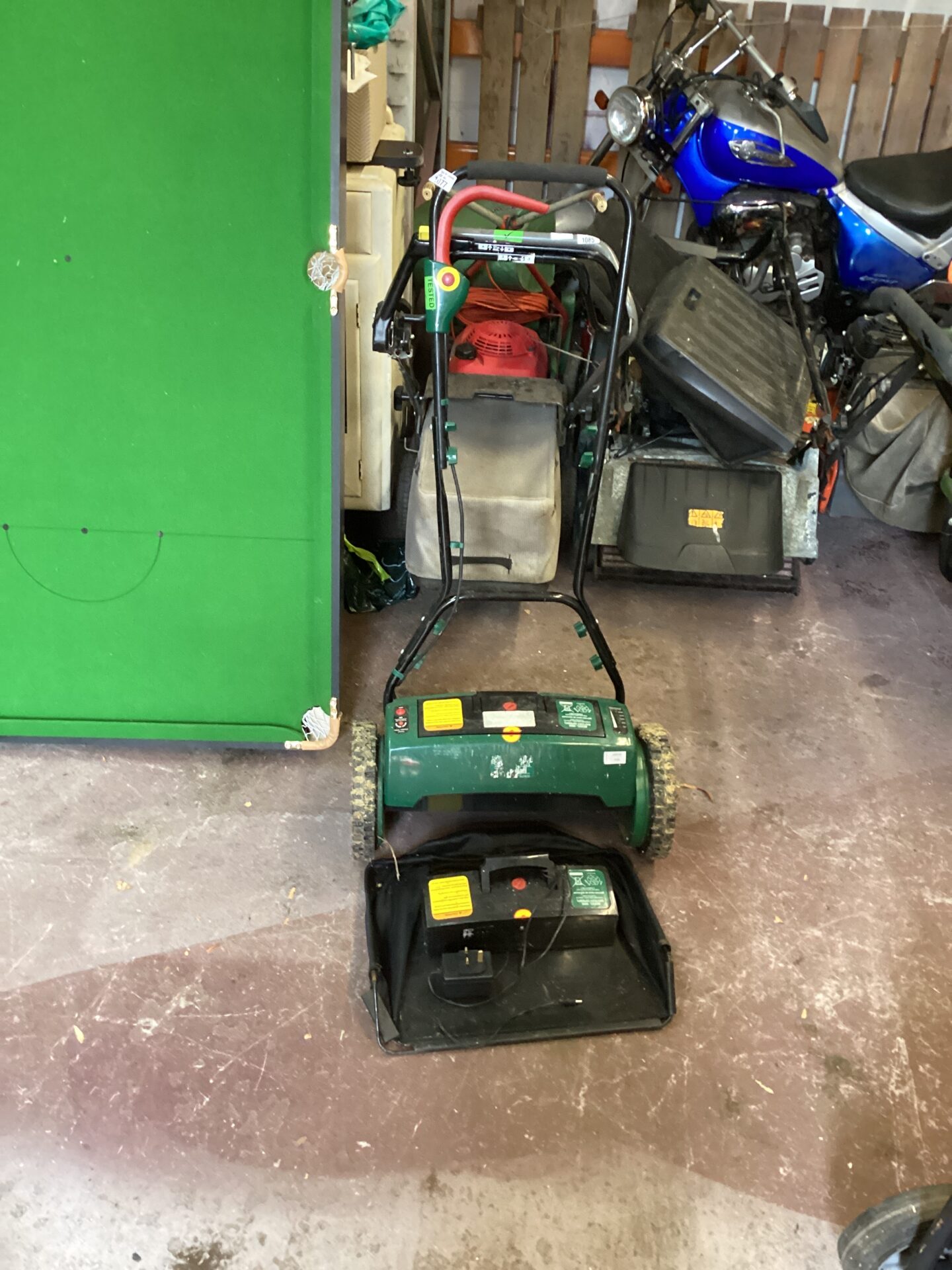 1077 Battery operated lawn mower with spare battery and charger tested and working