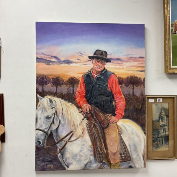 Large oil painting of John Wayne on horseback by W Nims.