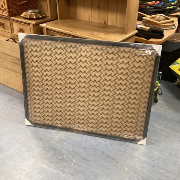 Large cork notice board for displaying memos and notices.