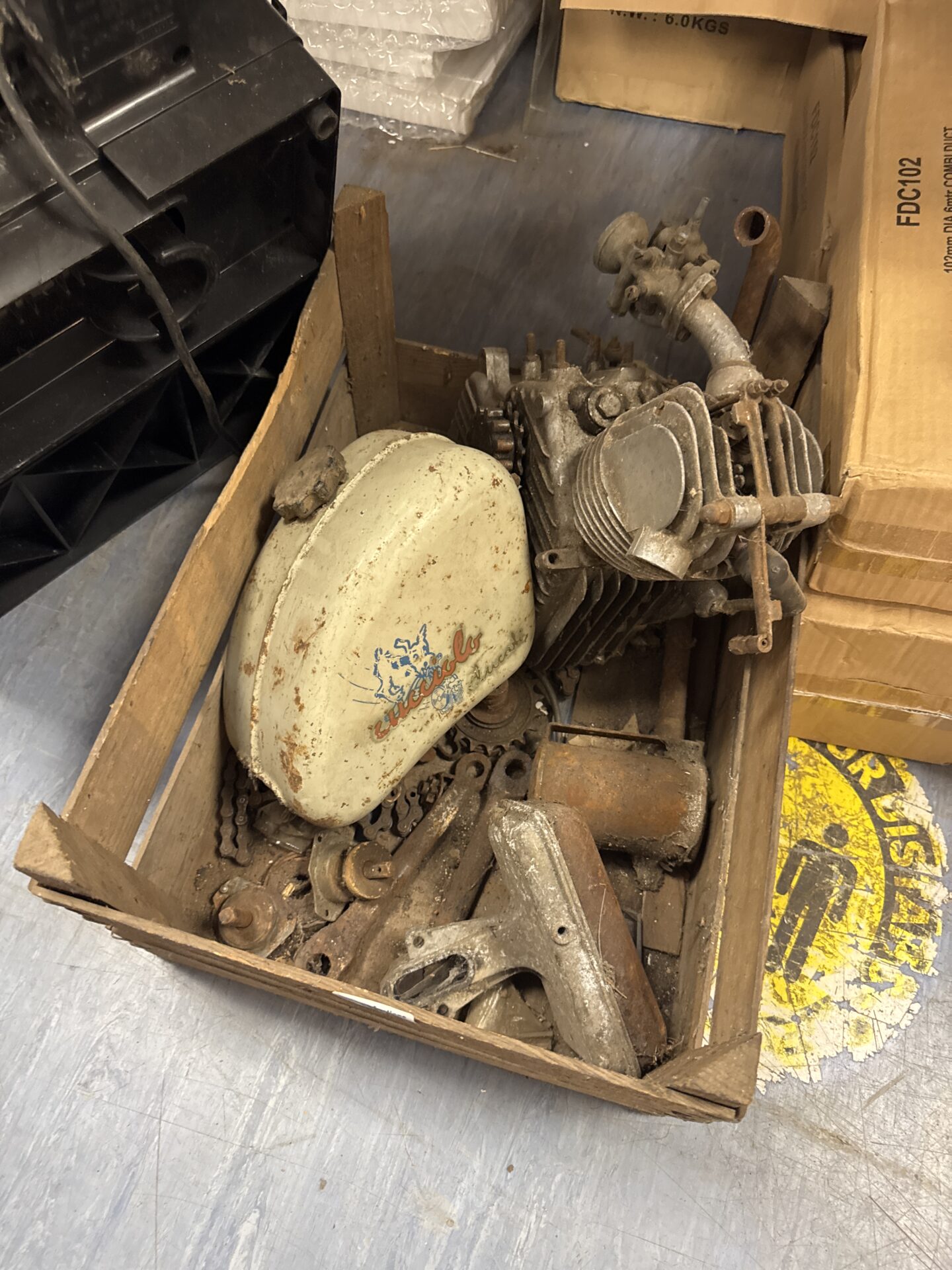 1006 Tray of vintage bycycle conversion kit parts Inc ducati engine and cucciolo fuel tank and parts for conversion